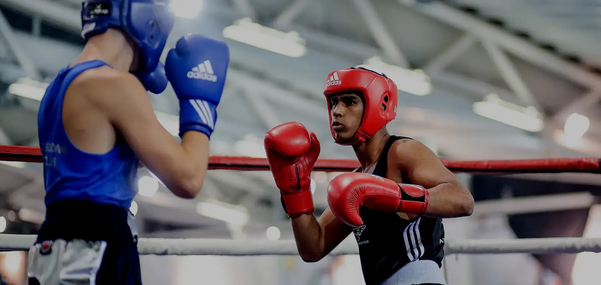 two men boxing in a gym